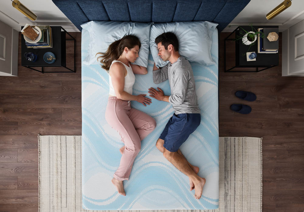 couple sleeping on tempur-pedic activebrezee