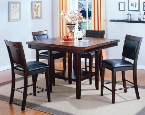 The compact Fulton Dining Set is a great choice for a traditional kitchen nook. This square counter table comes with four traditional dining stools, plus it has a built-in lazy Susan and a storage shelf.