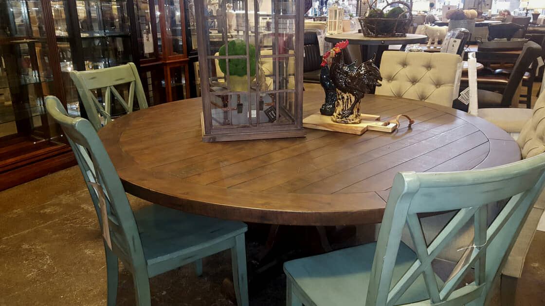 Photo of table with mismatched chairs