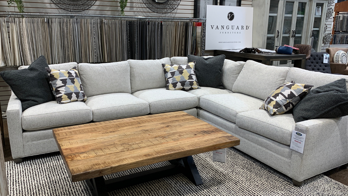 Vanguard American Bungalow Fairgrove Sectional in light gray with rustic coffee table