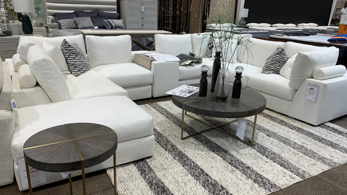 Vanguard Ease Lucca 7 Piece Sectional in cream color with round coffee and end table